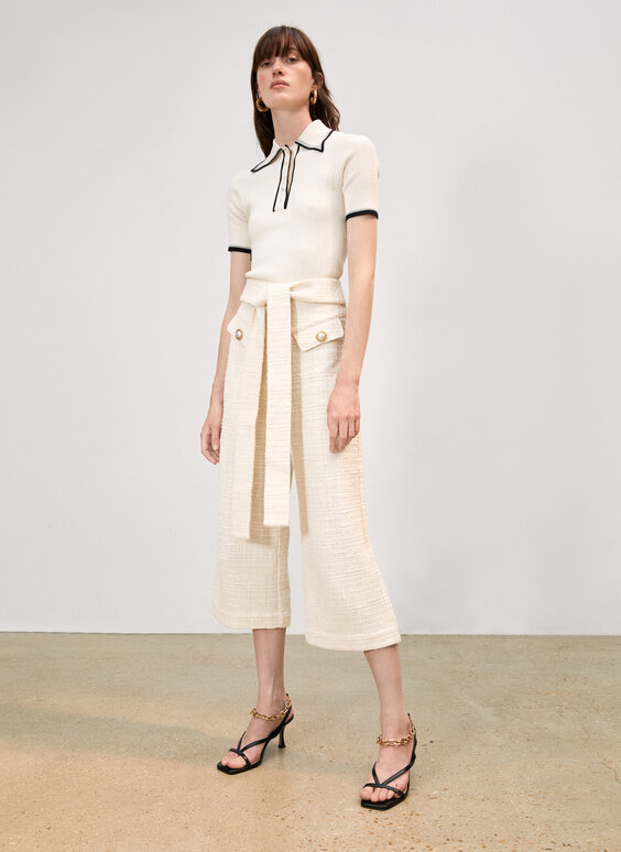 Trousers in textured cloth and faux pearl buttons