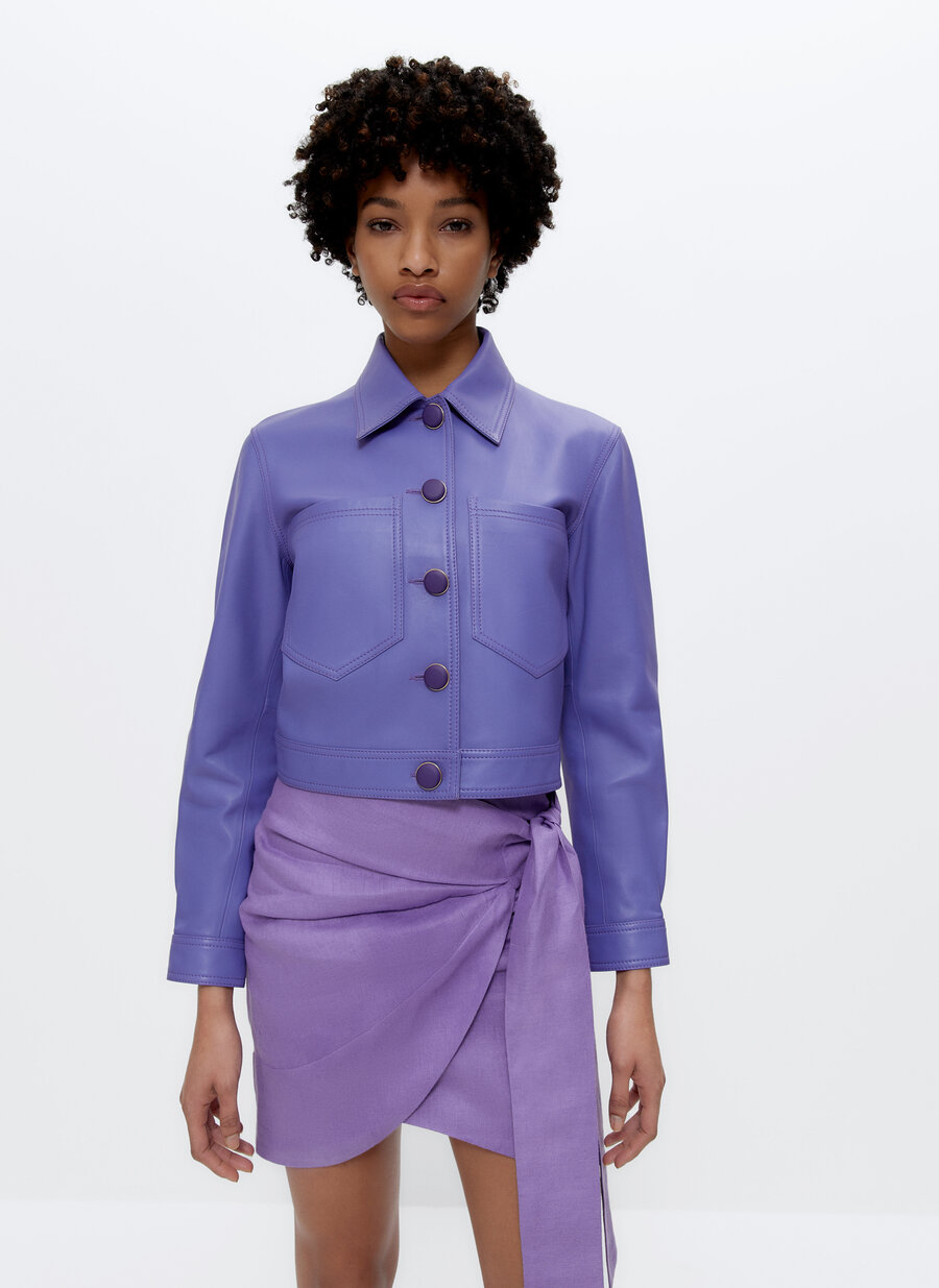 Uterque mauve cropped LEATHER JACKET WITH centre button fastening and double patch chest POCKETS. It is cropped with a shirt style collar and buttoned cuffs. 