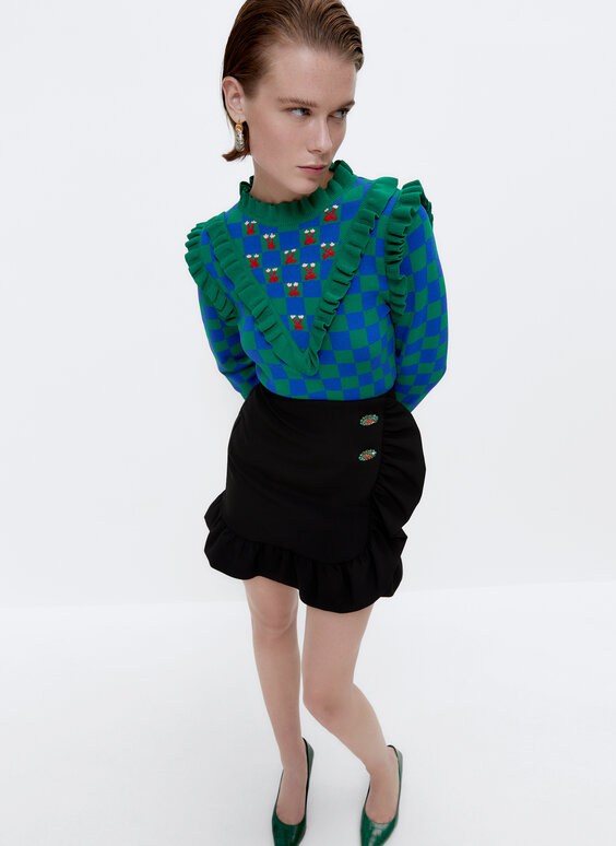 Check sweater with embroidered detail