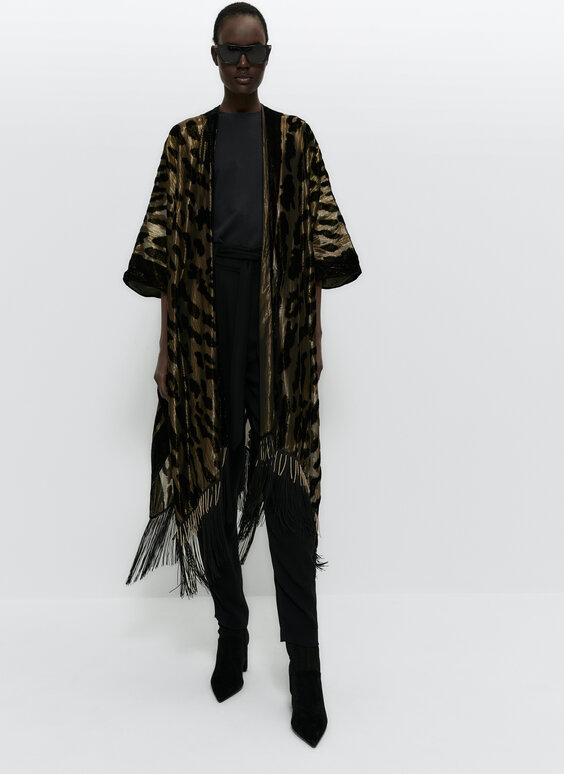 Long poncho with gold metallic thread, fringing and beads